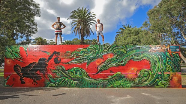 Street artists Paul Round (left) and Frank Maiorana with their mural at Peanut Farm Reserve in St Kilda.
