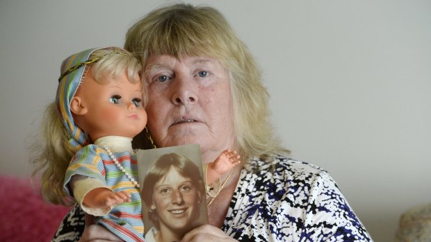 Elvira Buckingham with a picture of her daughter Michelle.