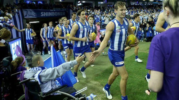 Kangaroos coach Brad Scott said that, while it was important to put on a good game, sick children helped keep some perspective.
