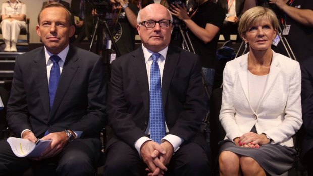 Former prime minister Tony Abbott with Attorney-General Senator George Brandis and Foreign Affairs Minister Julie Bishop in February 2015.