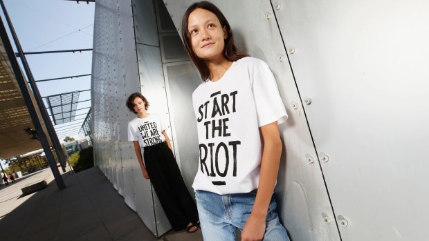 Models Nicola Clarke and Rachal Rutt show off some House of Riot T-shirts on Friday.