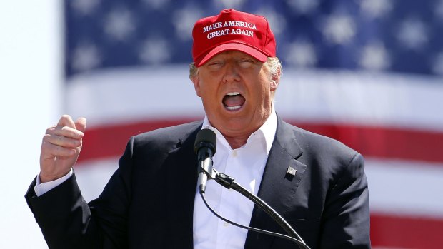 Donald Trump on the campaign trail in one of the signature baseball caps. 