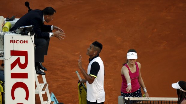 Kyrgios argues with the umpire during his match against Roger Federer.