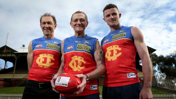 Pearce Hanley (right) with former Fitzroy champions Gary Wilson and Kevin Murray at the Junction Oval on Friday.
