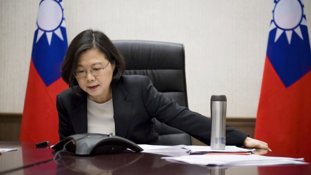 The office of Taiwanese President Tsai Ing-wen – seen here on the phone with Donald Trump on Friday – has scotched talk of a meeting with Trump's transition team.