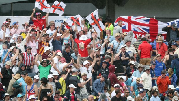 Welcome break: England fans cheer as rain stops play on day four at the WACA.