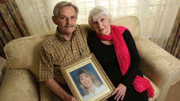 John and Helen Magill with a picture of their daughter Jane Thurgood-Dove. A suspected go-between in her murder contract is alive and a reward is on offer.