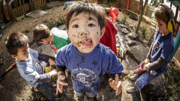 Kinder kids playing in the mud play area at East Burwood Preschool.
