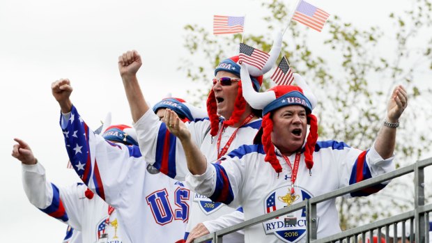 US fans cheer during a practice round for the Ryder Cup at Hazeltine National Golf Club.