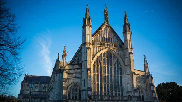 Sunlight catches the main facade of the cathedral in Wiltshire.