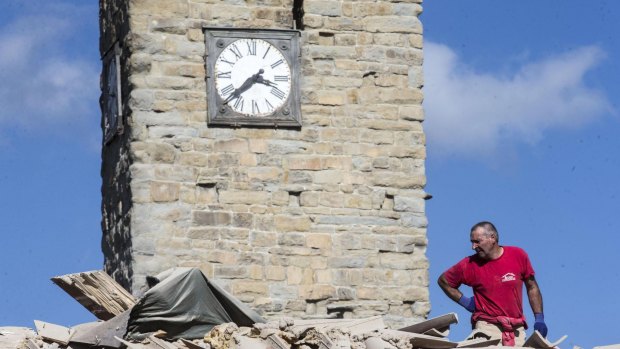 The clock of the Bell Tower of the Italian village of Amatrice is stopped at the time when an earthquake struck central Italy.