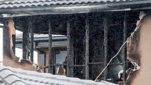 The boys' uncle charged into the room despite the flames.