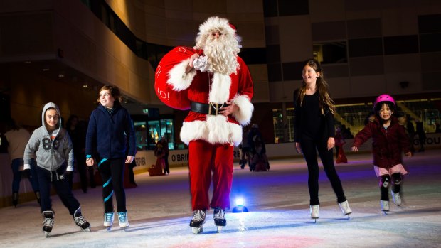 Cooler Santa: A lucky Father Christmas got a gig ice skating at O'Brien Group Arena in Docklands.