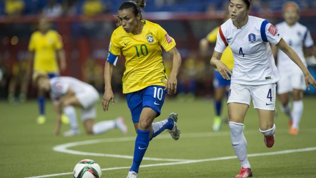 Brazil's Marta, left, is chased by South Korea's Shim Seoyeon during a Group E match at the Women's World Cup in Montreal on June 9.    