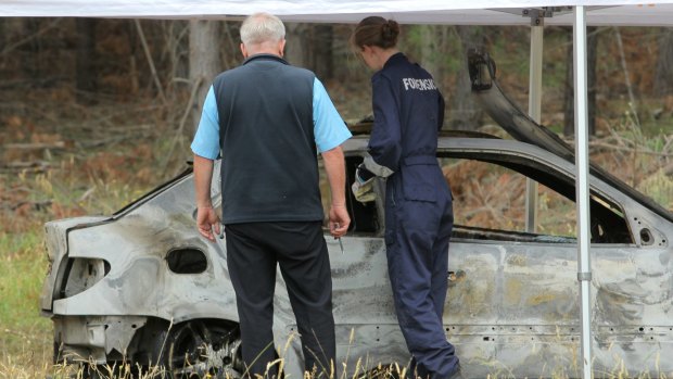 Homicide Squad detectives have joined the search for a missing woman who's burnt out car was found in Myrtleford.