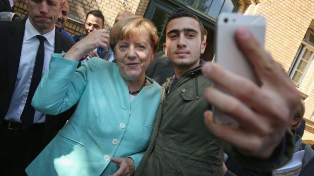 In September German Chancellor Angela Merkel posed for a selfie with a migrant from Syria after she visited a shelter for migrants in Berlin.