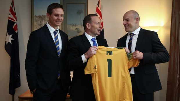 One for the pool room: Former Prime Minister Tony Abbott meets Wallabies assistant coach Stephen Larkham and Wallabies captain Stephen Moore in August.