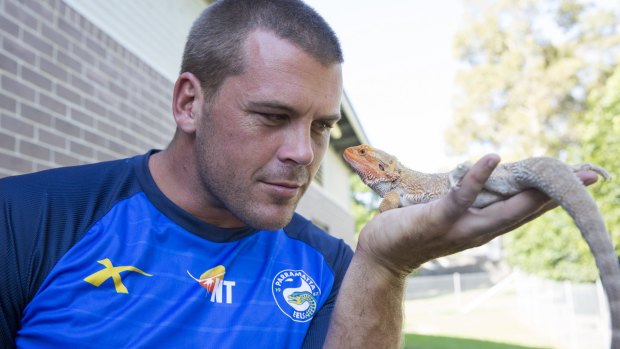 Full scale: Parramatta's Danny Wicks gets up close and personal with a lizard.