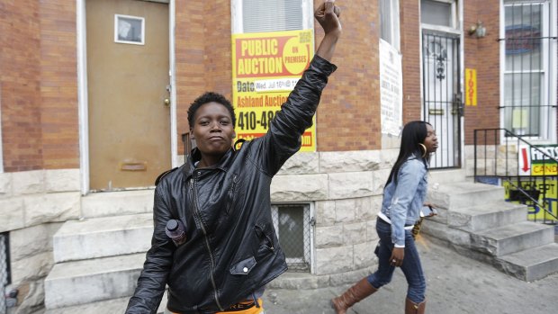 Renay Battle, left, and Charvae Day, right, react to the news.