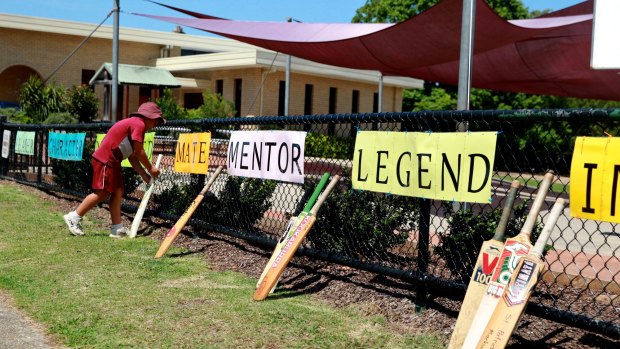 Students line up bats alongside words that describe their cricketing hero at St Patrick's Primary School, Phillip Hughes’s former school, in Macksville. 