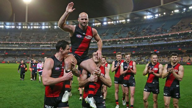 Paul Chapman of Essendon is chaired from the field after his last match for the club.