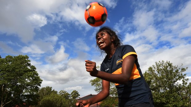 Shadeene Evans, 14, from Borroloola in the Northern Territory, runs through some football drills at Westfield Sport High School.