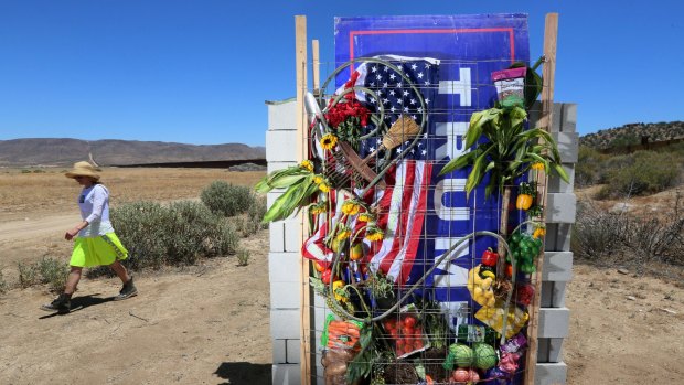 Mary Mihelic at the art installation - the beginnings of Donald Trump's putative border wall - she and David Gleeson built in Jacumba Hot Springs, California. 