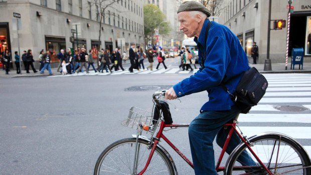 Bill Cunningham bicycling to work in New York.