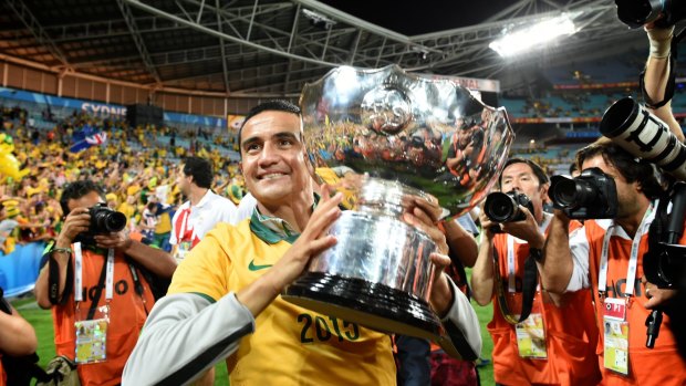Look out world: Tim Cahill enjoys the plaudits after winning the Asian Cup with the Socceroos.