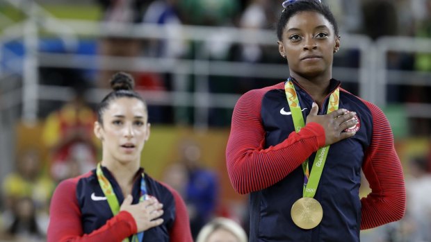 American Olympic medallists Simone Biles (right) and Aly Raisman heard their anthem again and again in Rio.