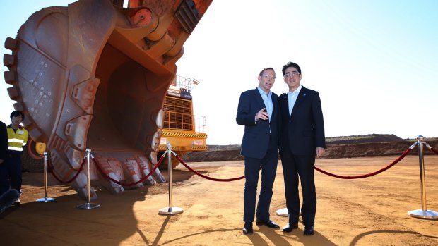 Tony Abbott shows Shinzo Abe a Rio Tinto iron ore mine in Western Australia.