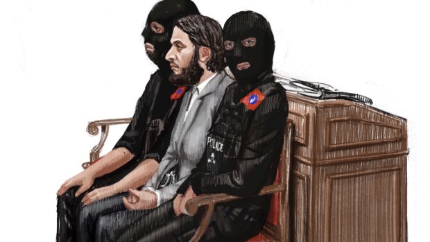 A courtroom sketch shows Salah Abdeslam between two masked police officers during the opening of his trial in Brussels. 