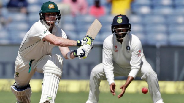 Front foot: Steve Smith combats India's spinners during his unbeaten knock. 