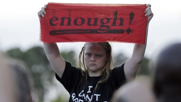 Asia Cromwell wears a T-shirt honouring Eric Garner during a rally for the killing of Walter Scott.