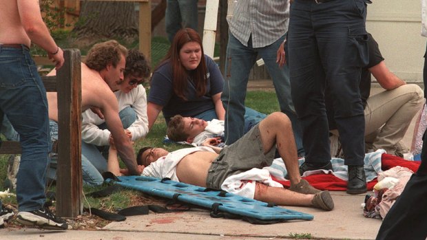 Rescuers tend to the wounded at a triage area near Columbine High School during a shooting rampage by Eric Harris and Dylan Klebold.