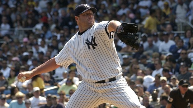New York Yankees pitcher Roger Clemens delivers the ball to the Seattle Mariners. 