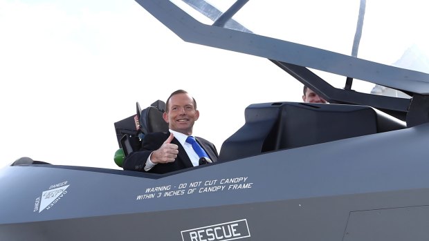 Then prime minister Tony Abbott in a replica F-35 jet in Canberra in 2014.