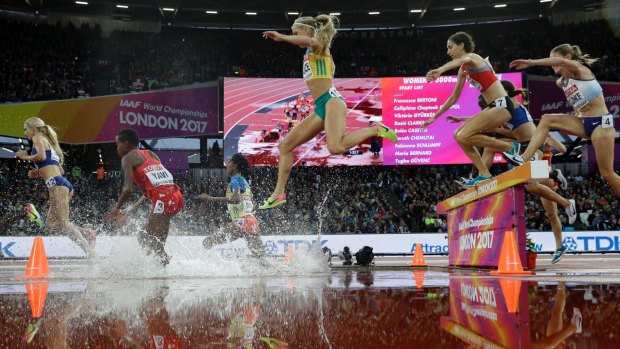 LaCaze, centre, competes in her 3000m steeplechase heat.