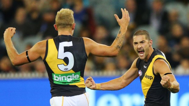 Brandon Ellis (left) and Shaun Grigg of the Tigers celebrate.