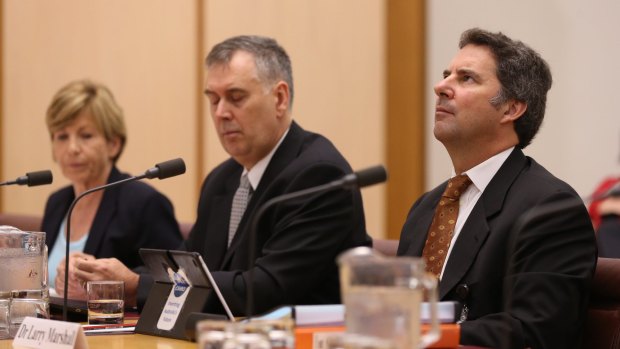 CSIRO chief executive Larry Marshall, right,  with his deputy Craig Roy, centre, and chief financial officer Hazel Bennett at the Senate hearing. 