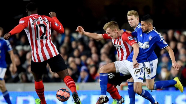Southampton's James Ward-Prowse vies for the ball with Ipswich Town's Kevin Bru.