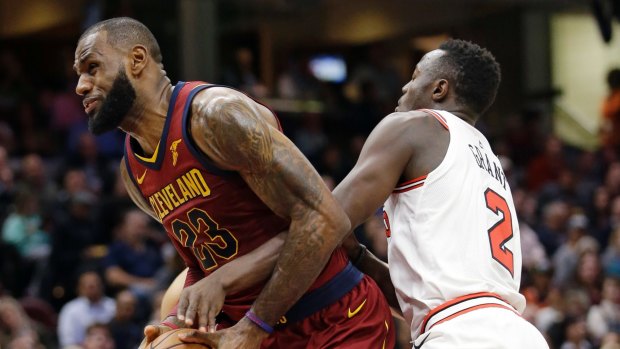 LeBron James (left) is fouled by Chicago's Jerian Grant.