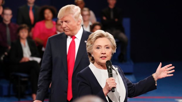 Donald Trump stands behind Hillary Clinton at the second Presidential debate.