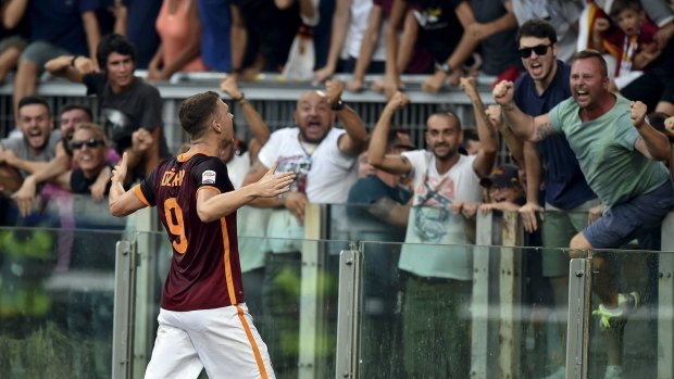 Roma's Edin Dzeko celebrates after scoring against Juventus.