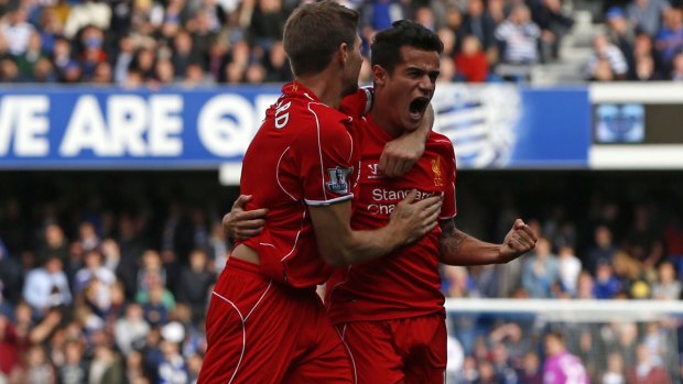 Philippe Coutinho (right) celebrates his goal with Steven Gerrard.