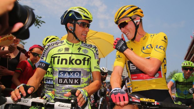 What a day: Australian Rohan Dennis chats with Spanish start Alberto Contador during his day in yellow in the Tour de France.