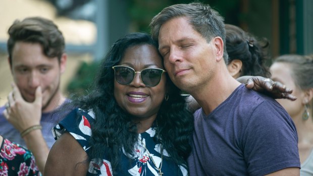 Don Damond, Justine Damond's fiance, is comforted outside his home by Valerie Castile, the mother of Philando Castile.