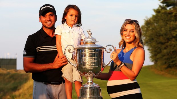 Jason Day, son Dash and wife Ellie pose with the Wanamaker trophy.
