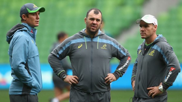 Michael Cheika (centre) with assistant coaches Stephen Larkham (left) and Nathan Grey (right).