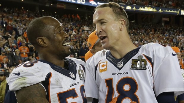 MVP Miller and Peyton Manning celebrate.